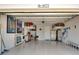 Spacious two-car garage with ample storage and shelving provides organization at 8077 Sandstar Way, Sarasota, FL 34240