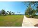 A beautiful green space overlooks the community lake and provides walking paths at 8077 Sandstar Way, Sarasota, FL 34240