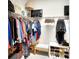 A walk-in closet featuring wire shelving and clothing racks, offering ample storage space at 8077 Sandstar Way, Sarasota, FL 34240