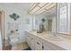 Well-lit bathroom with a double sink vanity, and decorative accents creating a relaxing atmosphere at 8531 Imperial Cir, Palmetto, FL 34221