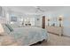 Light-filled bedroom with soft blue walls, carpet floors, and a well-lit view at 8531 Imperial Cir, Palmetto, FL 34221
