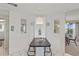 Eat-in kitchen with a small breakfast bar, stylish lighting, and adjacent views of a dining room at 8531 Imperial Cir, Palmetto, FL 34221