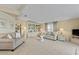 Cozy living room featuring comfortable seating and built-in shelving and soft natural light at 8531 Imperial Cir, Palmetto, FL 34221