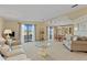 Open-concept living room with serene water views, dining area, and comfortable furnishings at 8531 Imperial Cir, Palmetto, FL 34221