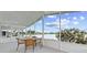 Screened in patio space featuring lake views and outdoor seating for relaxing and entertaining at 8531 Imperial Cir, Palmetto, FL 34221