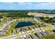 New home construction in a community with surrounding ponds and lush green areas at 8656 40Th E Cir, Palmetto, FL 34221