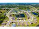 Aerial view of a Primary-planned community featuring multiple ponds, lush landscaping, and well-maintained homes at 8656 40Th E Cir, Palmetto, FL 34221