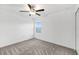 Bedroom with neutral decor, ceiling fan, carpeted floor and bright window view at 8656 40Th E Cir, Palmetto, FL 34221