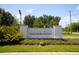 Elegant community entrance sign with manicured landscaping creating a welcoming first impression at 8656 40Th E Cir, Palmetto, FL 34221