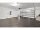Spacious two-car garage with epoxy flooring and an automatic door at 8656 40Th E Cir, Palmetto, FL 34221