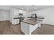 Open kitchen with stainless steel appliances, granite countertops and a large kitchen island at 8656 40Th E Cir, Palmetto, FL 34221