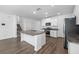 Modern kitchen featuring stainless steel appliances, granite countertops and large island at 8656 40Th E Cir, Palmetto, FL 34221