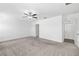 Large bedroom with neutral walls, carpeted floors, and a ceiling fan at 8656 40Th E Cir, Palmetto, FL 34221