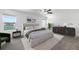 Beautiful bedroom featuring neutral tones, complemented by lake views and modern furnishings at 8656 40Th E Cir, Palmetto, FL 34221