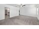 Bright, carpeted bedroom with en-suite bathroom and walk-in closet at 8656 40Th E Cir, Palmetto, FL 34221