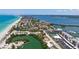 Breathtaking aerial view of beachfront condos, coastline, and sparkling waters, offering luxurious waterfront living and leisure at 8897 Midnight Pass Rd # 407, Sarasota, FL 34242