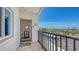 Condo balcony view with coastal scenery featuring tile floors, and outdoor living area at 8897 Midnight Pass Rd # 407, Sarasota, FL 34242
