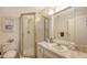 Bathroom featuring marble-top vanity, shower, and toilet at 8897 Midnight Pass Rd # 407, Sarasota, FL 34242