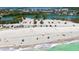 Overhead beach view of pristine sands, gentle waves, and convenient parking, ideal for beach lovers and outdoor enjoyment at 8897 Midnight Pass Rd # 407, Sarasota, FL 34242