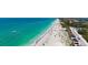 Beautiful beach view with crystal clear turquoise water, sandy shore, and blue skies, perfect for relaxation and recreation at 8897 Midnight Pass Rd # 407, Sarasota, FL 34242