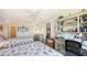 Bright bedroom with twin beds, side tables, built-in desk, and access to ensuite bathroom at 8897 Midnight Pass Rd # 407, Sarasota, FL 34242
