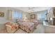Bright bedroom featuring two twin beds and a comfortable chair with a serene ambiance at 8897 Midnight Pass Rd # 407, Sarasota, FL 34242