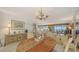 Charming dining room with elegant decor and views of the waterway from the sliding doors to the lanai at 8897 Midnight Pass Rd # 407, Sarasota, FL 34242