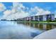 Exterior view showcasing the waterfront and residences, offering a glimpse into community living at 8897 Midnight Pass Rd # 407, Sarasota, FL 34242