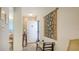 Bright foyer featuring a decorative wall hanging and stylish bench seating at 8897 Midnight Pass Rd # 407, Sarasota, FL 34242