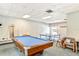 Resident game room features a pool table, ping pong table, and cozy seating at 8897 Midnight Pass Rd # 407, Sarasota, FL 34242