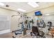 On-site gym featuring weight machines, treadmill, and free weights at 8897 Midnight Pass Rd # 407, Sarasota, FL 34242