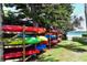 Outdoor kayak storage rack with colorful kayaks near the waterfront at 8897 Midnight Pass Rd # 407, Sarasota, FL 34242