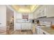 Well-lit kitchen with white appliances and plenty of counter space at 8897 Midnight Pass Rd # 407, Sarasota, FL 34242