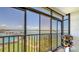 Relaxing screened lanai view overlooking the pool and Intracoastal waterway, perfect for enjoying the Florida scenery at 8897 Midnight Pass Rd # 407, Sarasota, FL 34242