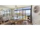 Enclosed lanai with dining set and relaxing views of the water and pool at 8897 Midnight Pass Rd # 407, Sarasota, FL 34242