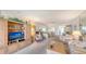 Spacious living area with entertainment center and comfortable seating arrangement at 8897 Midnight Pass Rd # 407, Sarasota, FL 34242