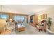 Cozy living room with large windows, comfortable seating, and a view of the Intracoastal waterway from the lanai at 8897 Midnight Pass Rd # 407, Sarasota, FL 34242