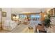 Comfortable living area featuring plush seating, a lanai with views, and a spacious layout for relaxation at 8897 Midnight Pass Rd # 407, Sarasota, FL 34242