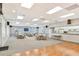 Community meeting room featuring ample seating, kitchenette, and natural light at 8897 Midnight Pass Rd # 407, Sarasota, FL 34242