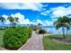 Manicured community walkway leading to waterfront amenities at 8897 Midnight Pass Rd # 407, Sarasota, FL 34242