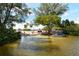 Community water access point with shady trees, parking, and kayak launch at 8897 Midnight Pass Rd # 407, Sarasota, FL 34242