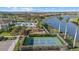 Aerial view of the community amenities, including pool, playground, and basketball court at 8982 Baroque Ter, Sarasota, FL 34240