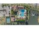 Overhead aerial view of the community clubhouse, pool, playground, and lake at 8982 Baroque Ter, Sarasota, FL 34240