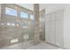 Modern bathroom with glass-enclosed shower featuring hexagon-patterned flooring at 8982 Baroque Ter, Sarasota, FL 34240