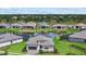 Beautiful home with a well-manicured lawn and a serene lake view, perfect for relaxing evenings at 8982 Baroque Ter, Sarasota, FL 34240