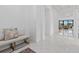 Elegant foyer featuring polished floors, neutral decor, and an inviting seating area, perfect for welcoming guests at 8982 Baroque Ter, Sarasota, FL 34240