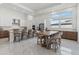 Spacious kitchen boasts white cabinetry, stainless steel appliances, and a large island with seating at 8982 Baroque Ter, Sarasota, FL 34240
