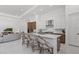 Open concept kitchen features a center island, stainless appliances, and views to the living area at 8982 Baroque Ter, Sarasota, FL 34240