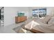 Bedroom with a large window overlooking the pool and a contemporary styled bed at 8982 Baroque Ter, Sarasota, FL 34240