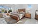Bedroom with a large window, a cozy rug, and a contemporary styled bed at 8982 Baroque Ter, Sarasota, FL 34240